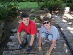 Nathan Slagle and Taylor Remsing lay pavers at the park. (Photos from NATHAN SLAGLE)