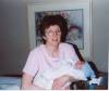 April 6, 2004: Linda holding her grandson, Austin John Sina at the hospital.