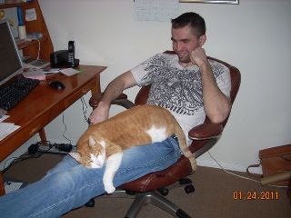 Greg Pacal relaxing with his kitty