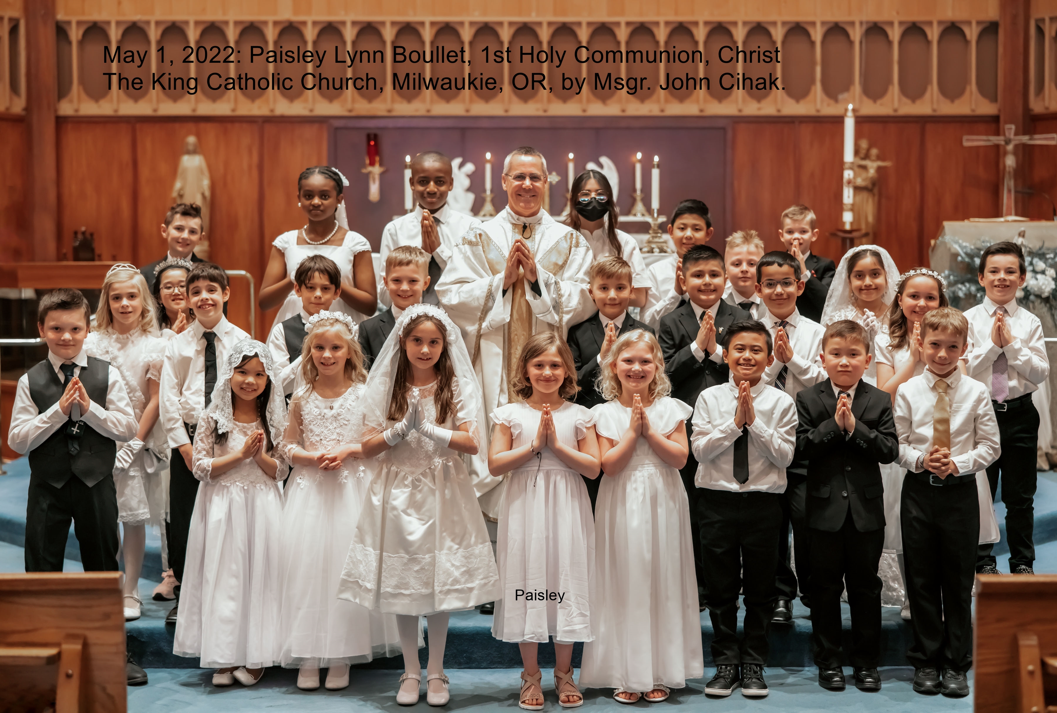 May 1, 2022:  Paisley Lynn Boullet 1st Holy Communion group picture with Msgr. John Cihak.