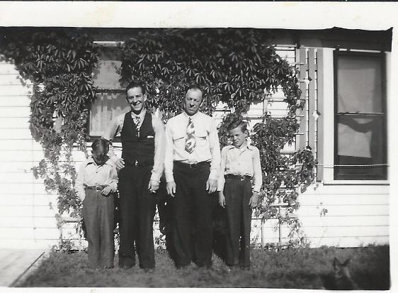 June 1945: Peter Keller and boys. Man in vest unidentified