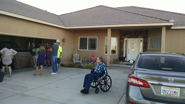 Pius by his car at Lindsey and Carla's home, July 17, 2016.