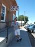Greg Pacal in front of the Hague, ND town cafe, August 6, 2005